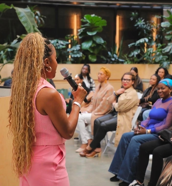 Wellness event speaker addressing the community audience